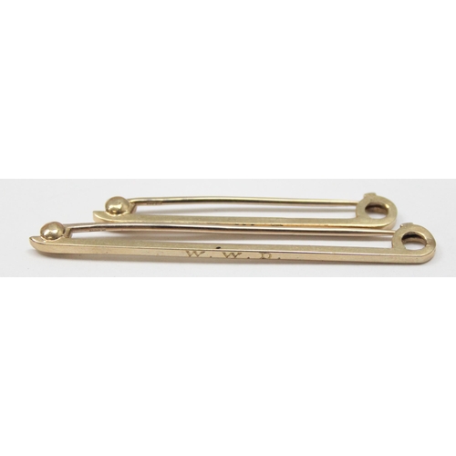 2442 - A pair of 9ct gold gentleman's tie pins in original box by Tessiers of Bond St, each engraved W.W.D ... 