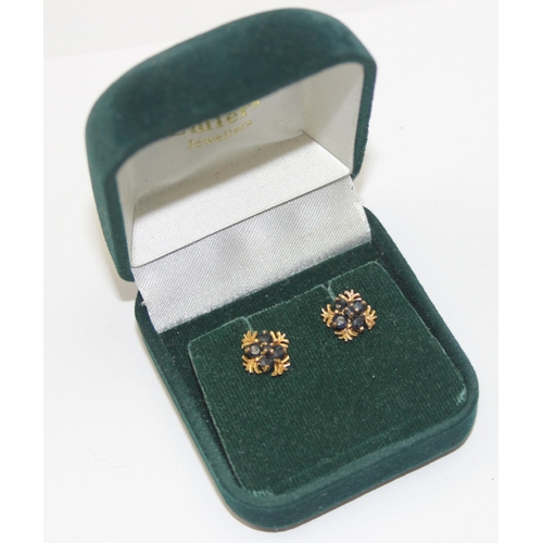 2449 - A pair of retro style 9ct gold earrings, each set with 4 small sapphires in square setting, marked a... 