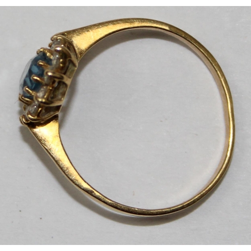 2450 - An 18ct gold floral set ring, a central Aquamarine surrounded by white stones, marked 750 and XRF co... 