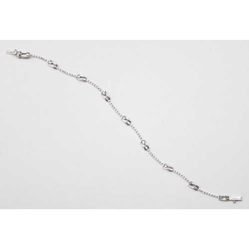 2452 - A retro style 18ct white gold and diamond set bracelet, marked and XRF confirmed, approx 20cm long, ... 