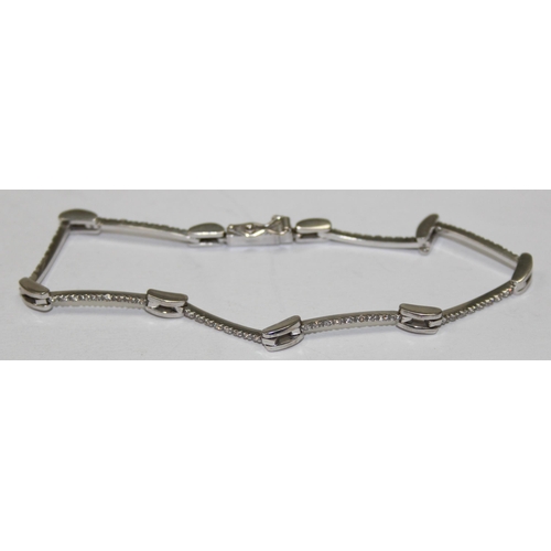 2452 - A retro style 18ct white gold and diamond set bracelet, marked and XRF confirmed, approx 20cm long, ... 