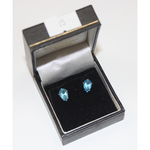 2457 - A pair of 9ct white gold and blue stone set stud earrings, each marked and XRF confirmed, presented ... 