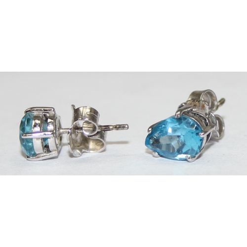 2457 - A pair of 9ct white gold and blue stone set stud earrings, each marked and XRF confirmed, presented ... 