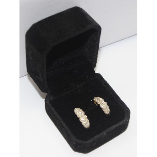 2453 - A pair of 9ct gold and pave diamond set earrings, marked and XRF confirmed, approx 2.61g gross