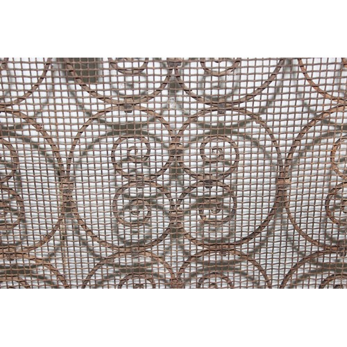 132 - A vintage wrought iron fire screen or spark guard, approx 63cm wide x 71cm tall