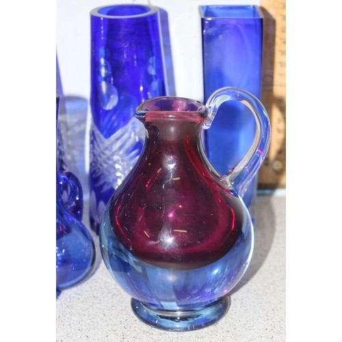 1709 - Qty of assorted vintage blue glass items to inc vases, jugs etc