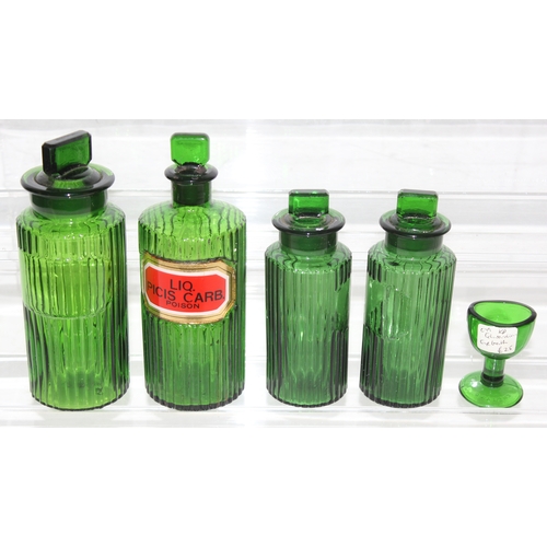 1732 - 4 vintage green glass apothecary bottles and a green glass eye bath (5)