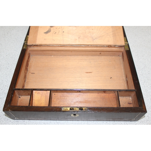 270 - An antique Rosewood writing slope with mother of pearl and polished pewter inlay and recessed brass ... 