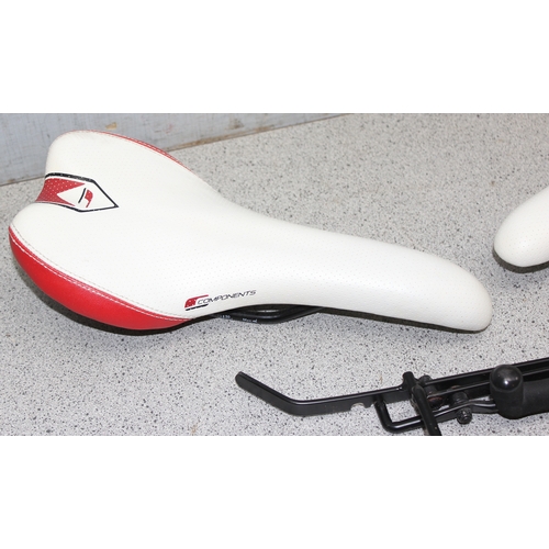 701 - 2 Components bicycle racing saddles & a bicycle rack