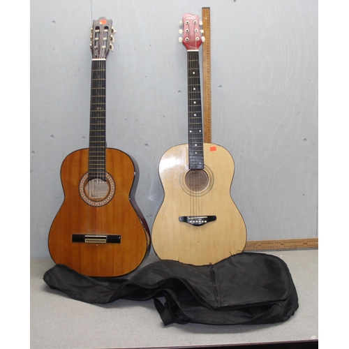 604 - 2 acoustic guitars, one with soft case