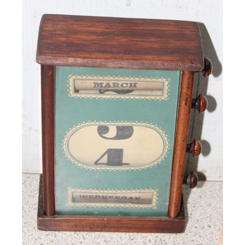 273 - A vintage mahogany cased desktop perpetual calendar, approx 15cm tall x 10cm wide, and an Art Deco p... 