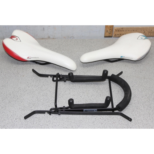 701 - 2 Components bicycle racing saddles & a bicycle rack