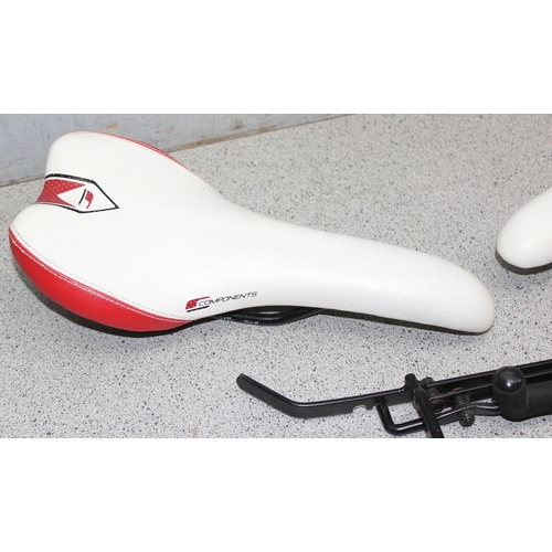 701 - 2 Components bicycle racing saddles & a bicycle rack