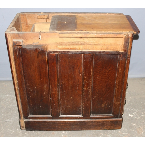 18 - An antique oak roll top desk with tambour front, approx 127cm wide x 76cm deep x 126cm tall