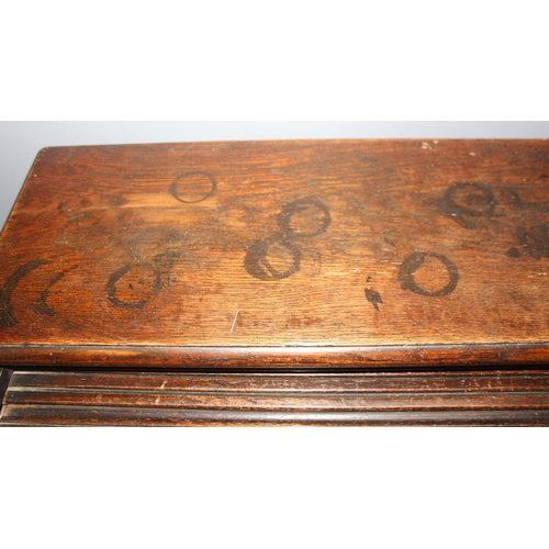 18 - An antique oak roll top desk with tambour front, approx 127cm wide x 76cm deep x 126cm tall