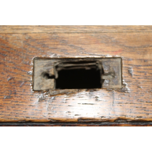 18 - An antique oak roll top desk with tambour front, approx 127cm wide x 76cm deep x 126cm tall