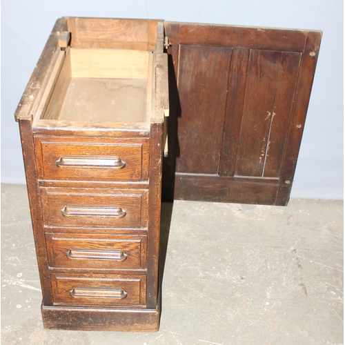 18 - An antique oak roll top desk with tambour front, approx 127cm wide x 76cm deep x 126cm tall