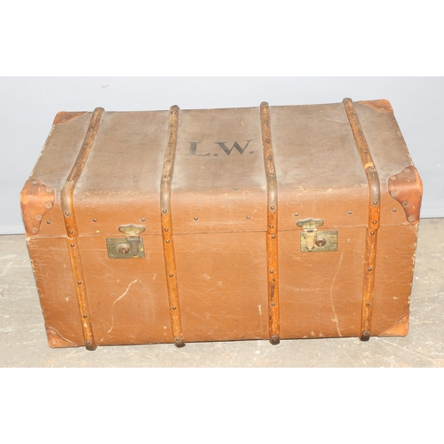 177 - An early 20th century flat topped wooden and canvas lined shipping trunk by Boswell & Co of Oxford, ... 