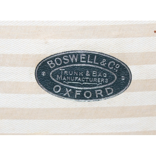 177 - An early 20th century flat topped wooden and canvas lined shipping trunk by Boswell & Co of Oxford, ... 