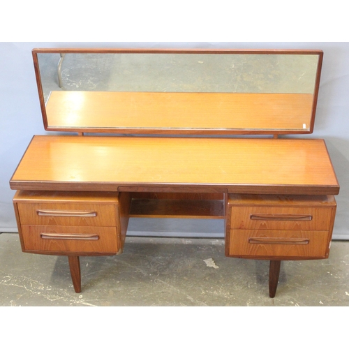 17 - A retro G-Plan tea dressing table with mirror and 4 drawers, approx 152cm wide x 46cm deep x 150cm t... 