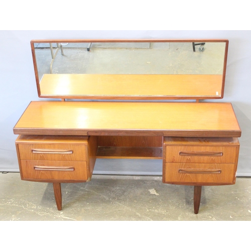 17 - A retro G-Plan tea dressing table with mirror and 4 drawers, approx 152cm wide x 46cm deep x 150cm t... 