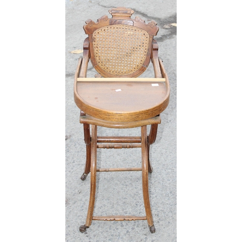 20 - An antique oak bergere seated child's high chair, approx 90cm tall