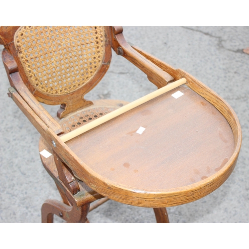 20 - An antique oak bergere seated child's high chair, approx 90cm tall