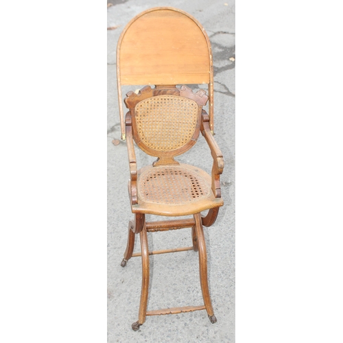 20 - An antique oak bergere seated child's high chair, approx 90cm tall