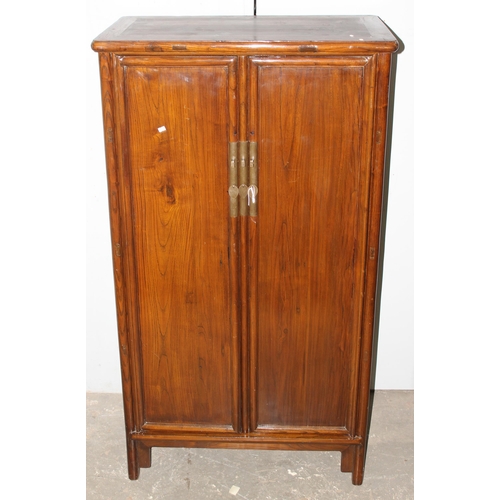 19 - A Chinese hardwood marriage cabinet, likely Elm with brass fittings, likely 20th century, approx 87c... 