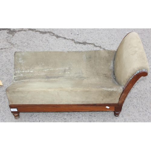 42 - A walnut and rosewood gout stool, the shaped upholstered foot rest on double ratchet height adjustab... 