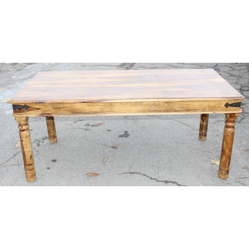 43 - A modern striated Indian hardwood dining table with iron accents, approx 179cm wide x 90cm deep x 77... 