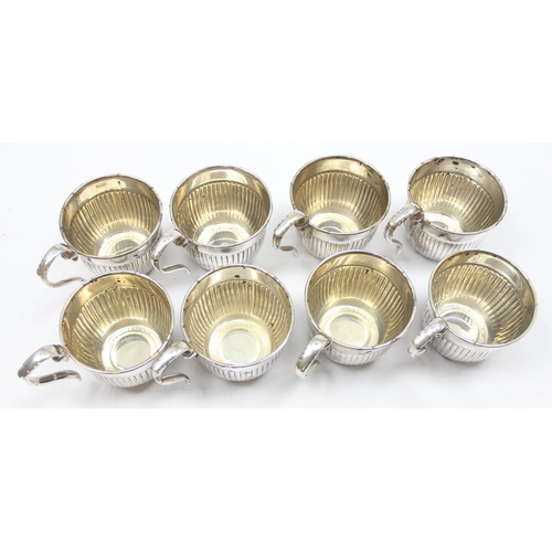 1001 - A large vintage silver plated punchbowl and 8 cups with half gadrooned design and a wavy crenelated ... 