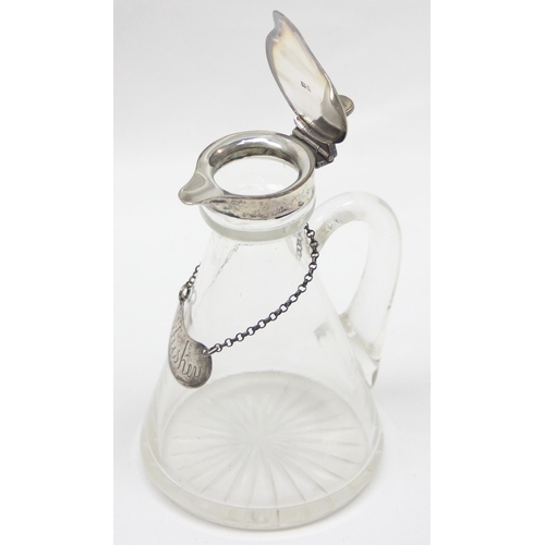 1003 - An Edwardian silver and glass Whisky noggin with star cut base, London 1909 by The Goldsmith's & Sil... 