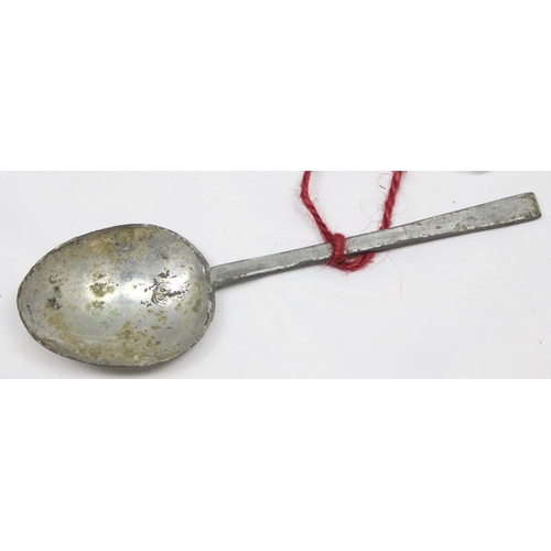 1006 - An antique pewter spoon with touchmark to bowl, hand written note that it was dug up in an orchard, ... 