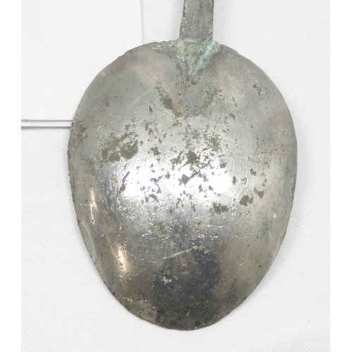 1006 - An antique pewter spoon with touchmark to bowl, hand written note that it was dug up in an orchard, ... 