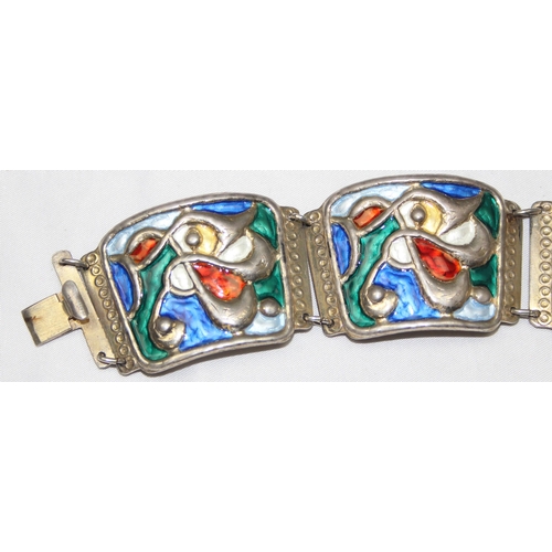 1103 - A Scandinavian silver and enamel bracelet by Oystein Balle of Norway, comprised of four linked panel... 