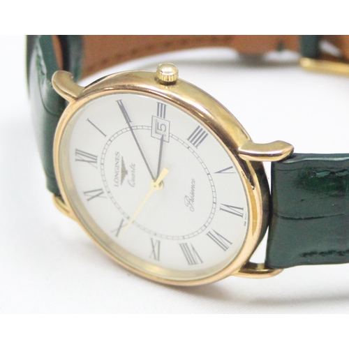 1303 - A Longines Quartz Presence 156-6801 dress watch with gold plated case, in original box with leather ... 