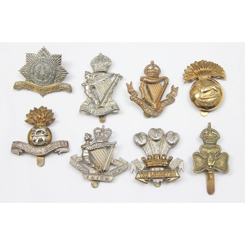 1417 - Military cap badges - 8 assorted military cap badges all relating to Ireland, to include Connaught R... 