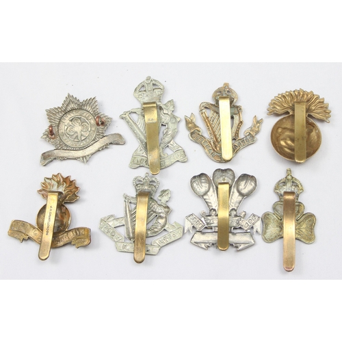 1417 - Military cap badges - 8 assorted military cap badges all relating to Ireland, to include Connaught R... 