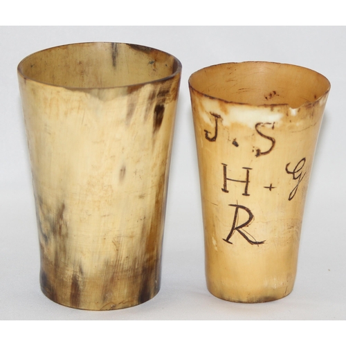 1653 - 2 antique horn beakers, one with engraved letters, the largest approx 11cm tall