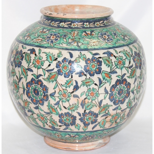 1656 - A Middle Eastern Iznik earthenware ovoid vase, decorated in the Islamic taste, with reserves of flow... 