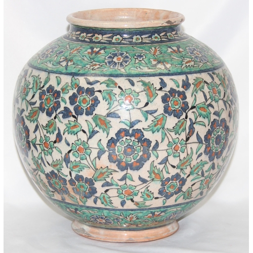 1656 - A Middle Eastern Iznik earthenware ovoid vase, decorated in the Islamic taste, with reserves of flow... 