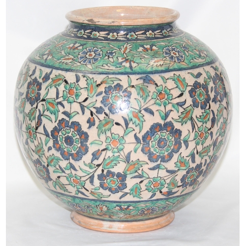 1656 - A Middle Eastern Iznik earthenware ovoid vase, decorated in the Islamic taste, with reserves of flow... 