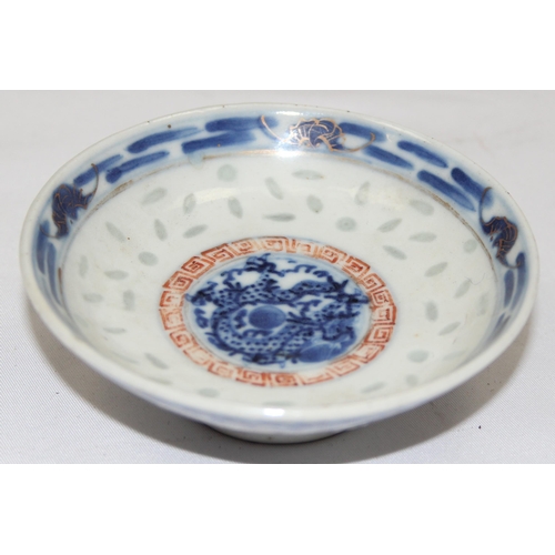 1659 - A small Chinese blue, red and white footed shallow rice bowl bearing 6 character Kangxi mark to base... 