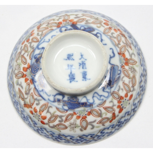 1659 - A small Chinese blue, red and white footed shallow rice bowl bearing 6 character Kangxi mark to base... 