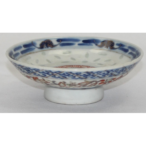 1659 - A small Chinese blue, red and white footed shallow rice bowl bearing 6 character Kangxi mark to base... 