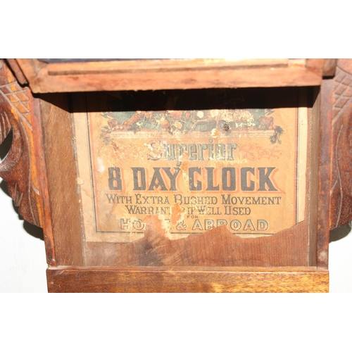 1312 - Decorative 8-day mechanical 'Superior' wall clock with inlaid detail, key and pendulum present, appr... 