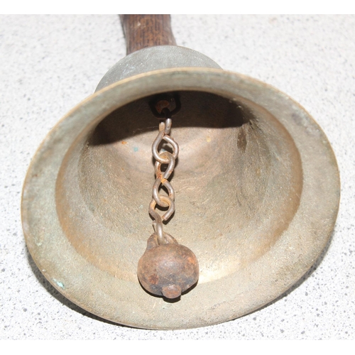 1646 - A vintage brass school bell with wooden handle, approx 24cm tall