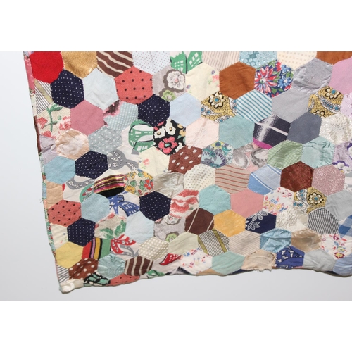 205 - A highly decorated colourful vintage patchwork quilt or blanket, likely early 20th century, approx 1... 