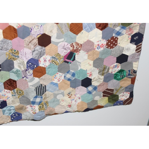 205 - A highly decorated colourful vintage patchwork quilt or blanket, likely early 20th century, approx 1... 